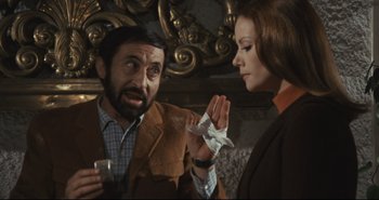 Movie still from “A Bay of Blood” (1971), directed by Mario Bava – A man and a woman looking at each other; Medium shot, Over the shoulder angle