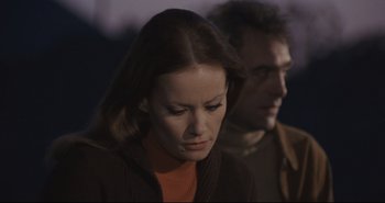 Movie still from “A Bay of Blood” (1971), directed by Mario Bava – A man and a woman looking down at each other; Close Up shot, Low angle