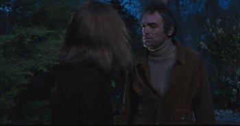 Movie still from “A Bay of Blood” (1971), directed by Mario Bava – A man and a woman talking in the woods; Medium shot, Over the shoulder angle