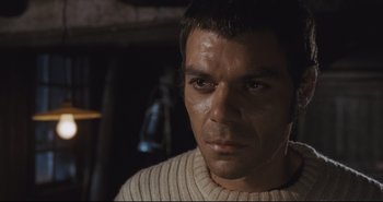 Movie still from “A Bay of Blood” (1971), directed by Mario Bava – A person wearing a sweater; Close Up shot, Over the shoulder angle