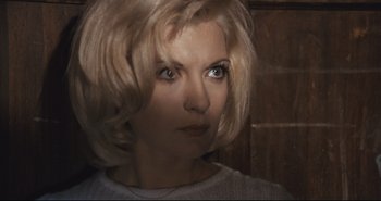 Movie still from “A Bay of Blood” (1971), directed by Mario Bava – A person with blonde hair; Close Up shot, High angle