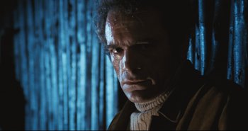 Movie still from “A Bay of Blood” (1971), directed by Mario Bava – A person wearing a sweater; Close Up shot, Low angle