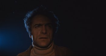 Movie still from “A Bay of Blood” (1971), directed by Mario Bava – A person wearing a sweater; Close Up shot, Low angle
