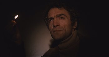 Movie still from “A Bay of Blood” (1971), directed by Mario Bava – A person wearing a scarf; Close Up shot, Low angle
