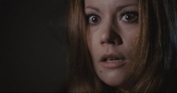Movie still from “A Bay of Blood” (1971), directed by Mario Bava – A woman's eyes and face; Close Up shot, High angle
