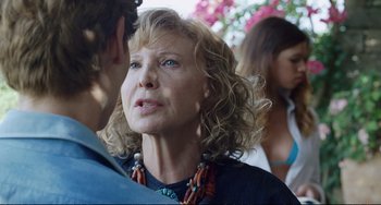 Movie still from “A Bigger Splash” (2015), directed by Luca Guadagnino – A person talking to another person; Close Up shot, Over the shoulder angle