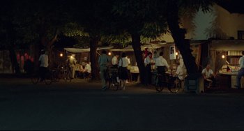 Movie still from “A Brighter Summer Day” (1991), directed by Edward Yang – A group of people standing next to each other on a street; Extreme Wide shot, High angle