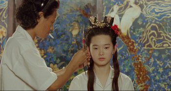 Movie still from “A Brighter Summer Day” (1991), directed by Edward Yang – A woman getting her hair done by a stylist; Close Up shot, Over the shoulder angle