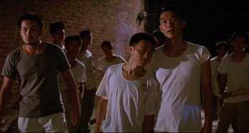 Movie still from “A Brighter Summer Day” (1991), directed by Edward Yang – A group of young men standing next to each other; Medium shot, Low angle