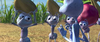 Movie still from “A Bug's Life” (1998), directed by John Lasseter – A group of cartoon bugs standing next to each other; Close Up shot, High angle