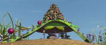 Movie still from “A Bug's Life” (1998), directed by John Lasseter – An animated scene of a bunch of ants standing around a tree; Extreme Wide shot, High angle