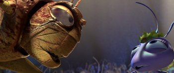 Movie still from “A Bug's Life” (1998), directed by John Lasseter – A bug's face with a crowd in the background; Extreme Close Up shot, Low angle