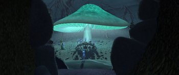 Movie still from “A Bug's Life” (1998), directed by John Lasseter – A group of people standing under a large green mushroom; Extreme Wide shot, High angle