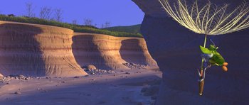 Movie still from “A Bug's Life” (1998), directed by John Lasseter – A view of a desert landscape from the ground; Extreme Wide shot, High angle
