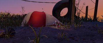 Movie still from “A Bug's Life” (1998), directed by John Lasseter – A red and white balloon sitting on top of a field; Extreme Wide shot, High angle