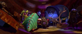 Movie still from “A Bug's Life” (1998), directed by John Lasseter – A group of cartoon characters in a room; Wide shot, High angle