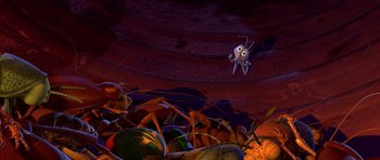 Movie still from “A Bug's Life” (1998), directed by John Lasseter – An animated scene of an ant in the middle of a pile of bugs; Extreme Wide shot, High angle