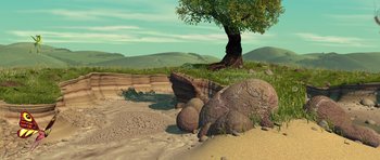 Movie still from “A Bug's Life” (1998), directed by John Lasseter – An image of a tree in the middle of the desert; Extreme Wide shot, High angle
