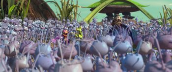 Movie still from “A Bug's Life” (1998), directed by John Lasseter – A bunch of purple ants that are in a field; Extreme Wide shot, High angle