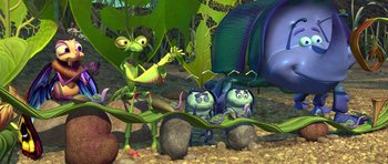 Movie still from “A Bug's Life” (1998), directed by John Lasseter – A group of cartoon characters sitting on rocks; Wide shot, Low angle