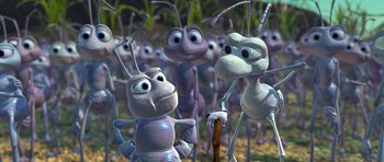 Movie still from “A Bug's Life” (1998), directed by John Lasseter – A bunch of ants that are standing in the grass; Extreme Close Up shot, High angle