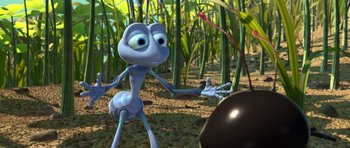 Movie still from “A Bug's Life” (1998), directed by John Lasseter – An animated character is standing in the grass; Extreme Close Up shot, High angle