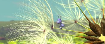 Movie still from “A Bug's Life” (1998), directed by John Lasseter – An animated bug is standing in the grass next to a plant; Wide shot, High angle