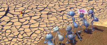 Movie still from “A Bug's Life” (1998), directed by John Lasseter – A group of ants standing on top of a dry ground; Extreme Wide shot, High angle