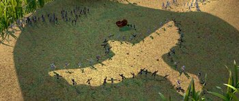 Movie still from “A Bug's Life” (1998), directed by John Lasseter – An aerial view of a group of people standing in a field; Extreme Wide shot, Overhead angle