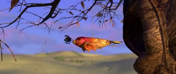 Movie still from “A Bug's Life” (1998), directed by John Lasseter – An orange and yellow fish hanging from a tree branch; Extreme Wide shot, Low angle