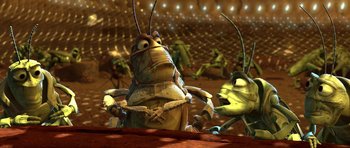 Movie still from “A Bug's Life” (1998), directed by John Lasseter – A group of cartoon bugs in a field; Medium shot, Low angle
