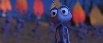 Movie still from “A Bug's Life” (1998), directed by John Lasseter – An animated bug is standing in a field of flowers; Extreme Close Up shot, High angle