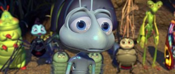 Movie still from “A Bug's Life” (1998), directed by John Lasseter – A cartoon of a bug with a bunch of other bugs behind it; Extreme Close Up shot, High angle