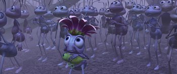 Movie still from “A Bug's Life” (1998), directed by John Lasseter – A group of cartoon bugs in a field; Wide shot, High angle