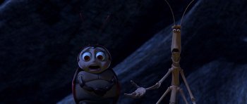 Movie still from “A Bug's Life” (1998), directed by John Lasseter – A creepy looking bug next to a creepy looking skeleton; Medium shot, High angle