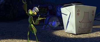 Movie still from “A Bug's Life” (1998), directed by John Lasseter – Two cartoon characters are standing in the dirt; Wide shot, High angle