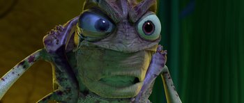 Movie still from “A Bug's Life” (1998), directed by John Lasseter – The face of a green creature; Extreme Close Up shot, High angle