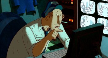 Movie still from “A Cat in Paris” (2010), directed by Alain Gagnol – An animated picture of a man sitting in front of a computer; Medium shot, High angle