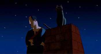 Movie still from “A Cat in Paris” (2010), directed by Alain Gagnol – A black cat sitting on top of a brick wall next to a man; Medium shot, Low angle