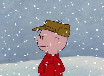 Movie still from “A Charlie Brown Christmas” (1965), directed by Bill Melendez – A cartoon of a man in a red shirt and a brown hat; Close Up shot, High angle