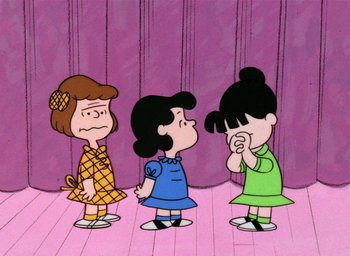 Movie still from “A Charlie Brown Christmas” (1965), directed by Bill Melendez – A group of three cartoon characters standing next to each other; Extreme Wide shot, High angle