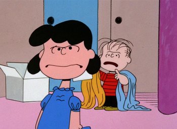 Movie still from “A Charlie Brown Christmas” (1965), directed by Bill Melendez – A charlie brown and lucy cartoon scene; Medium shot, Over the shoulder angle