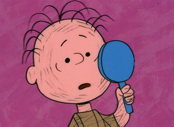 Movie still from “A Charlie Brown Christmas” (1965), directed by Bill Melendez – A drawing of a boy looking through a magnifying glass; Close Up shot, High angle