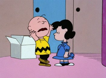 Movie still from “A Charlie Brown Christmas” (1965), directed by Bill Melendez – A charlie brown and lucy cartoon scene; Medium shot, High angle
