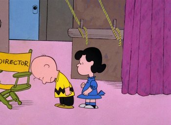 Movie still from “A Charlie Brown Christmas” (1965), directed by Bill Melendez – A charlie brown and lucy cartoon scene; Extreme Wide shot, High angle