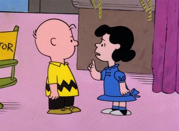 Movie still from “A Charlie Brown Christmas” (1965), directed by Bill Melendez – A charlie brown and a girl talking to each other; Medium shot, High angle
