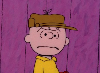 Movie still from “A Charlie Brown Christmas” (1965), directed by Bill Melendez – A charlie brown cartoon character with a hat on his head; Close Up shot, High angle
