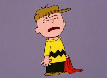 Movie still from “A Charlie Brown Christmas” (1965), directed by Bill Melendez – A charlie brown cartoon character with a hat on; Close Up shot, High angle