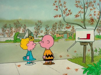 Movie still from “A Charlie Brown Thanksgiving” (1973), directed by Phil Roman – A charlie brown and a girl in front of a mailbox; Extreme Wide shot, High angle