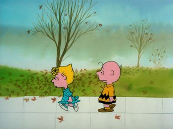 Movie still from “A Charlie Brown Thanksgiving” (1973), directed by Phil Roman – A couple of cartoon characters standing next to each other on a sidewalk; Extreme Wide shot, High angle